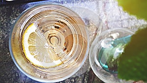 Top view close-up of glass of lemonade sparkling wine a piece of lemon,Selective focus.