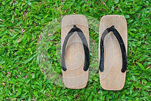 Top view close up old wooden sandal with a thick sole.