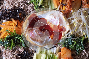 Top view Close up of Traditional dish food Spicy Homemade Korean Bibimbap Rice with Egg vegetables