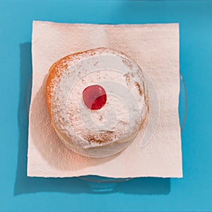 Top view closeup of a Hanukkah mocks sufganiyah doughnut photo