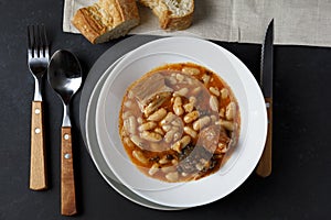 Top view closeup shot of Fabada Asturiana, a soup with cooked beans photo