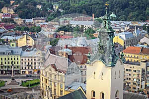 Top view closeup from town hall tower on old high catholic cathedral tower in Lviv city