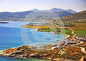 Top view of coastline with green hills
