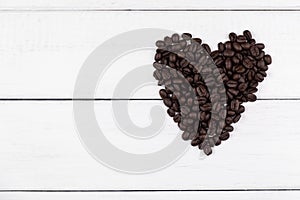 Top view of coffee beans in heart shape