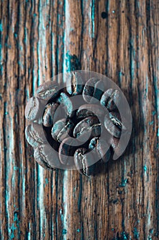 Top view of coffee beans on wood background, Colour retro style, Thailand