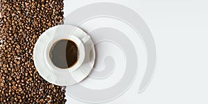 Top view of coffee cup on coffee bean texture and white background. Restaurant cafe shop creative menu