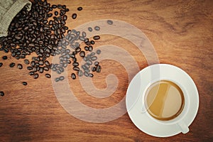 top view coffee cup and beans on wood