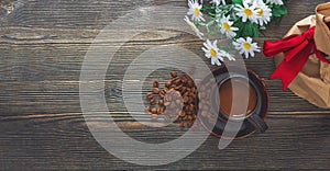 Top view of coffee cup and coffee beans, flower and gift box stock photo