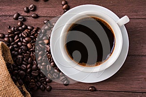 Top view /Coffee cup and coffee beans on table