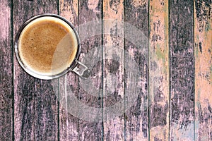 Top view of coffee cup on wooden table background