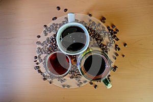 Top view of coffee cups with coffee beans photo