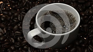 Top view of coffee or espresso with piles of coffee beans. Close up. Comestible. photo