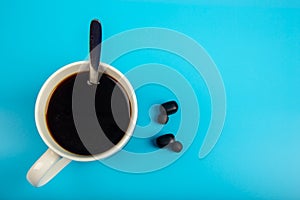 Top view Coffee and smartphone with Wireless bluetooth headphones