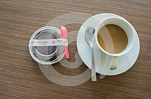 Top view, coffee in white cup, wood background