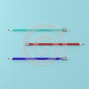 Top view of collection of three pencils color horizontal on point pattern blue background. minimal creative concept. case study c