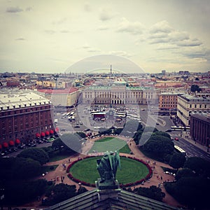 Top view from the colonnade of St. Isaac`s Cathedral on St. Isaac`s Square and the city. Saint-Petersburg, Russia. Square photo