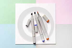Top view of color painting markers on the office creative art layout concept with soft colours d