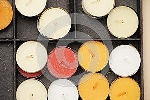 top view of colored candles in a box. flat lay