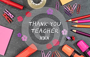 Thank you teacher text background with colorful school supplies.