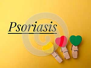 Top view colored wooden clips with text Psoriasis