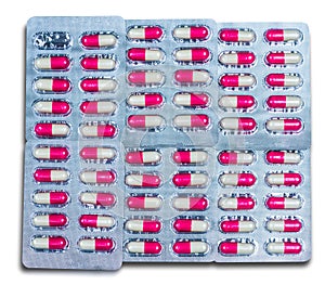 Top view of colorful antibiotic capsules pills in blister packs isolated on white background. Global health care and drug use with