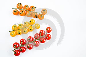 Top view of colorful cherry tomatoes on a white background