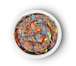 Top view of colorful chocolate buttons in bowl  on a white background