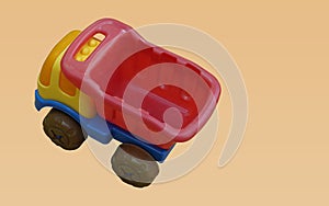 top view colorful plastic truck toy on orange background, object, toy, play, banner, template, decor, copy space