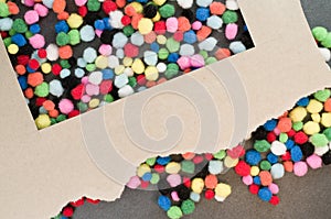 Top view of colorful small softballs with a box frame