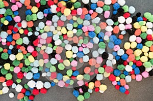 Top view of colorful softballs on a brown surface