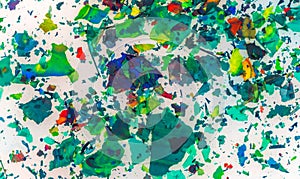 Top view of colorful torn pieces of paper on a white background