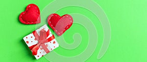 Top view colorful valentine background made of gift boxes and red textile hearts. Valentine\'s Day concept with copy space