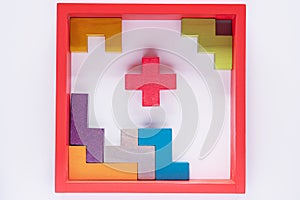 Top view on colorful wooden blocks folding on white background