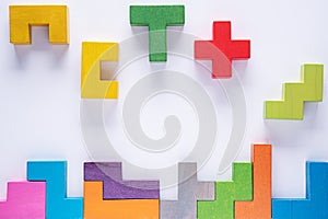 Top view on colorful wooden blocks folding on white background