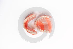 Top view of complete denture on white background. Full denture close-up. Dentures. Isolate on white background.