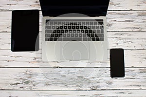 Top view of a computer accompanied on vintage wooden background