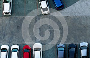 Top view concrete car parking lot. Aerial view of car parked at car parking area of apartment. Outdoor parking space with empty