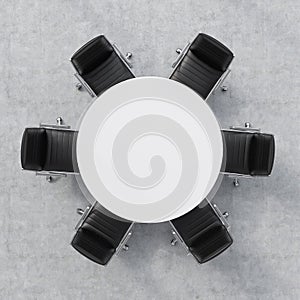 Top view of a conference room. A white round table and six chairs around. Office interior. 3D rendering. photo