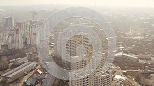 Top view of construction cranes and process of constructing new high-rise buildings in Ñity Kharkov, Ukraine. The