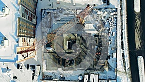 Top view of a construction site with a residential house on it