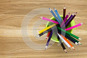 Top-view of container filled with coloring pencils