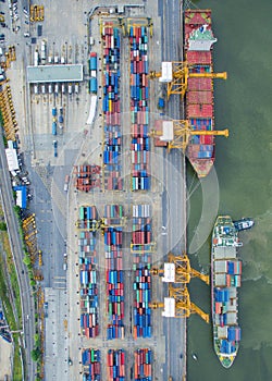 Top view of container ship unloading in port