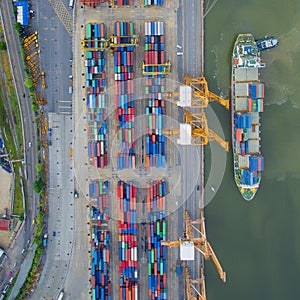 Top view of container ship unloading in port