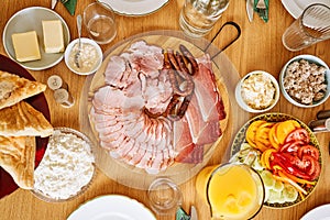 Top view of continental breakfast on wooden table