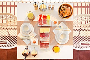 Top view of continental morning breakfast table setting.