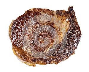 Top view of cooked rib eye beef steak isolated