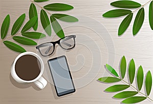 Top view with copy space of white working table with green leaf,  smartphone, cup of coffee and eye glasses