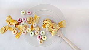 Top view of Corn Flakes and Fruit Loops Cereal on Background