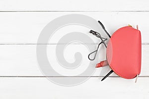 Top view of cosmetics  on white wood background