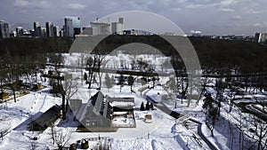 Top view of cottage town in suburbs in winter. Creative. Beautiful town with private houses in suburbs. Village near